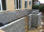 DURING: Access to the ramp was limated to only the smallist machinery, Interlocking concrete block walls constructed with block & beam EDPM lined roof for deck with underfloor room and storage.