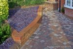 Low brick planter wall with brick on edge to finish