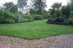 Flower beds & lawn edged with treated timber edging and sawn sleepers
