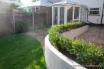 Block rendered wall with Sleek curved lines to match patio edge