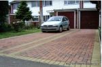 Shared driveway installed with Marshall's Driveline 50 in red and buff border