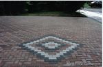 Driveway installed with Marshall's Driveline 50 pavers in brindle with feature diamond pattern 
