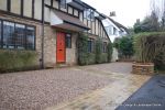 Sweeping sandstone path installed leading to front door, driveway perimeter edged with sandstone setts all hand pointed, Natural sandstone wall constructed with crease tile and 6mm Scottish beach gravel installed to 
