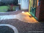 Sweeping sandstone path installed leading to front door, driveway perimeter edged with sandstone setts all hand pointed, Natural sandstone wall constructed with crease tile and 6mm Scottish beach gravel installed to