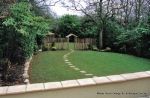 Fresh topsoil and new lawn installed with curved stepping stone path leading to tranquil arbour seating all overgrown shrubs and trees carefully cutback and new feature planting with lighting and irrigation installed