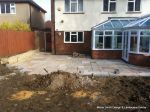 DURING: Lawn is removed topsoil installed and levelled and patio starts to take shape