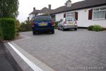 AFTER: Liner ACO drainage installed across the mouth of the driveway to comply with current regulations