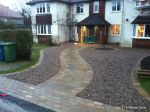 AFTER: Sweeping sandstone path installed leading to front door, driveway perimeter edged with sandstone setts all hand pointed, Natural sandstone wall constructed with crease tile and 6mm Scottish beach gravel installed to drive.