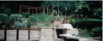 Sunken patio/dining area with natural Cotswald random stone retaining Walls with Integral BBQ and timber beams 