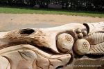 After: This mighty oak trunk is given a new lease of life with a beautifully carving of a woodland wildlife scene including butterflies, beetles oak leafs and acorns for the children of the nursery to enjoy for many generations to come. 