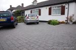 AFTER: New driveway installed using granite paving with contrasting colour band
