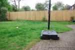 BEFORE: The patio was poorly built and to small and the lawn and beds were drab and tired looking