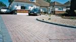 AFTER: Sweeping curved driveway installed with Marshalls Driveline 50 in brindle and Charcoal Kerbs  