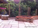 Garden needed a new landscape to match the character of the property a Sweeping ramp was installed with timber curved arbour, tumbled sandstone paving & circle installed and in cased with old stock brickwork capped with double bullnose steps built  with m