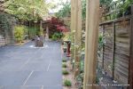 Town house garden paved with black limestone 