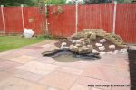 AFTER: Pond was refurbished and new sandstone patio installed 