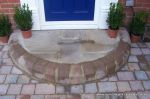 Sandstone patio with circle feature and squaring of kit 