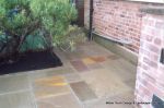 Sandstone patio with circle feature and squaring of kit 