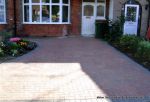 Driveway installed with Marshalls Driveline 50 in brindle with Sweeping curved flower bed