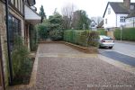 Sweeping sandstone path installed leading to front door, driveway perimeter edged with sandstone setts all hand pointed, Natural sandstone wall constructed with crease tile and 6mm Scottish beach gravel installed to drive