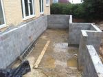 Deck and underfloor storage room built using Concrete block retaining wall with added rebar and concrete for strength