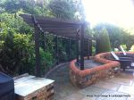 Curved timber arbour built on both a incline and radius