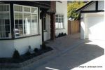 New driveway installed using Marshall's Tegula paving with contrasting charcoal border
